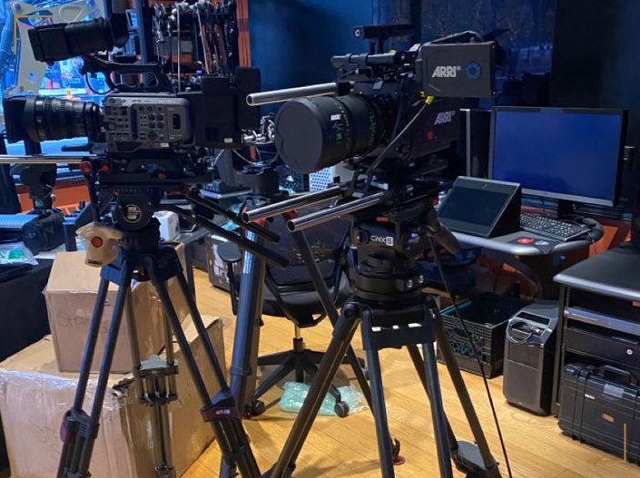 Professional cinema cameras on tripods in the IRIS gear room